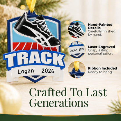 Hand-painted details and laser engraved personalization on the track christmas ornament, ribbon included