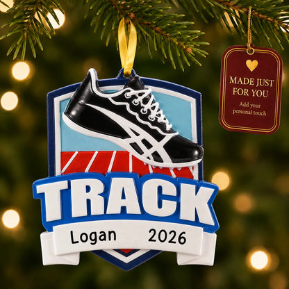 Track christmas ornament hanging on a lit Christmas tree with a Made Just For You gift tag