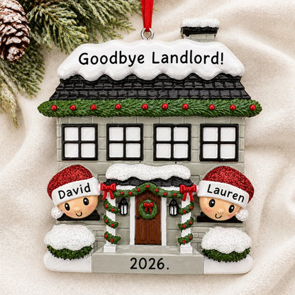 Personalized new home couple christmas ornament laid on a soft white knit blanket