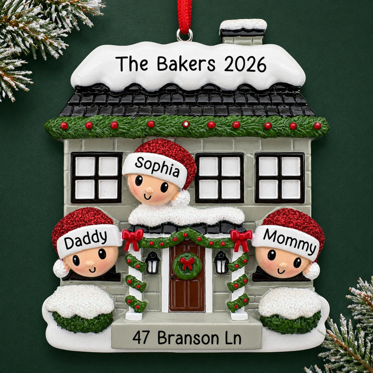 Personalized new home family of 3 christmas ornament on a dark green pine background