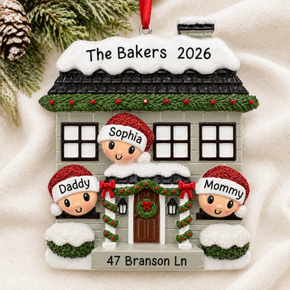Personalized new home family of 3 christmas ornament laid on a soft white knit blanket