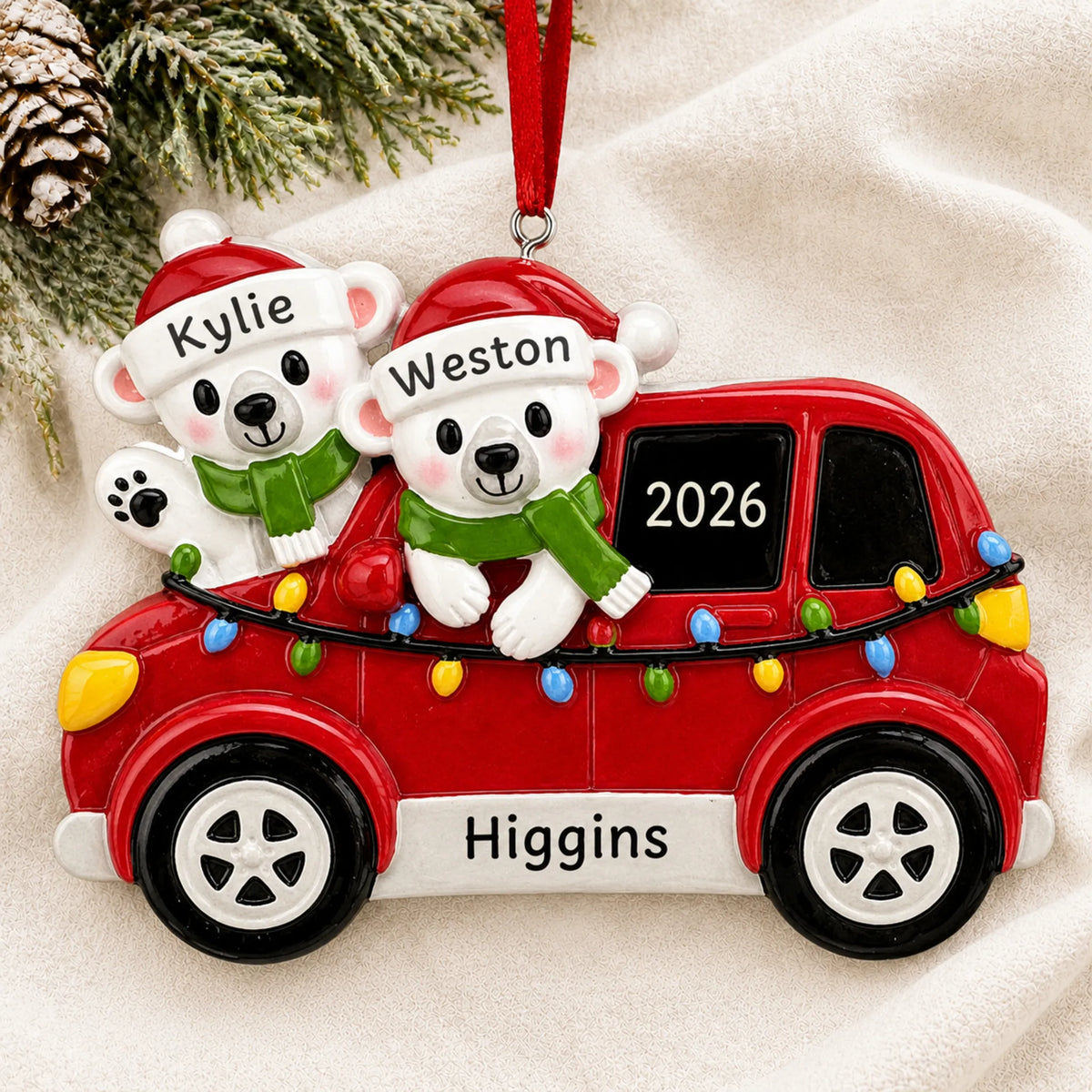 Personalized suv polar bear couple christmas ornament laid on a soft white knit blanket