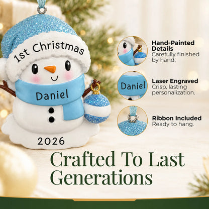 Hand-painted details and laser engraved personalization on the blue baby snowman christmas ornament, ribbon included