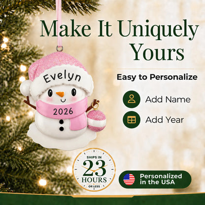 Make it yours: add name and year to the personalized pink baby snowman christmas ornament