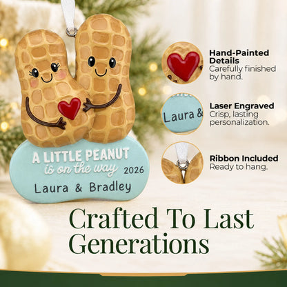 Hand-painted details and laser engraved personalization on the Little Peanut Expecting christmas ornament, ribbon included