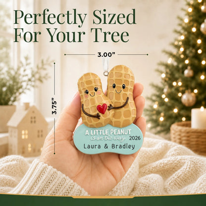 Size guide: the personalized Little Peanut Expecting christmas ornament is 3.00 in wide by 3.75 in tall, shown in hand