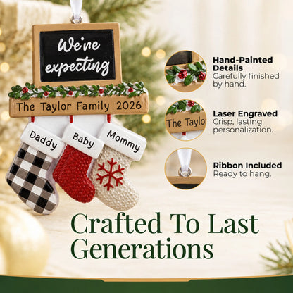 Hand-painted details and laser engraved personalization on the We're Expecting Couple's christmas ornament, ribbon included