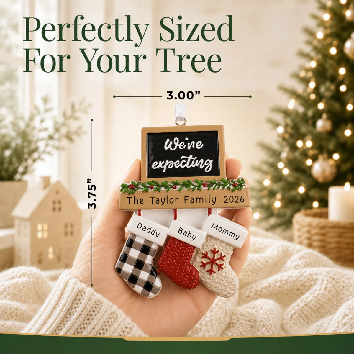 Size guide: the personalized We're Expecting Couple's christmas ornament is 3.00 in wide by 3.75 in tall, shown in hand