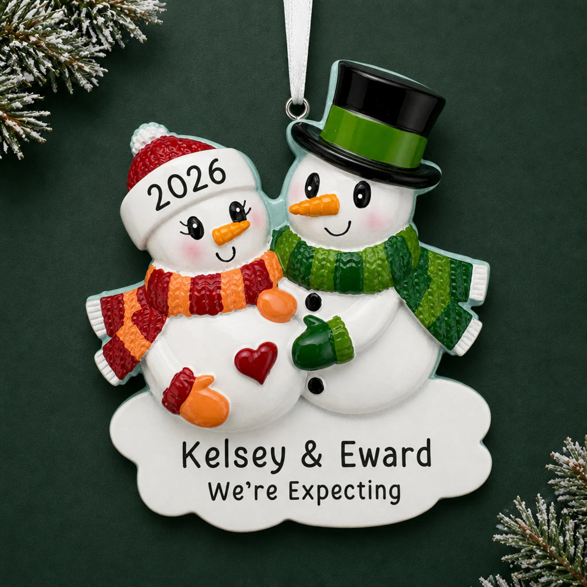 Personalized Expecting Snowman Couple christmas ornament on a dark green pine background