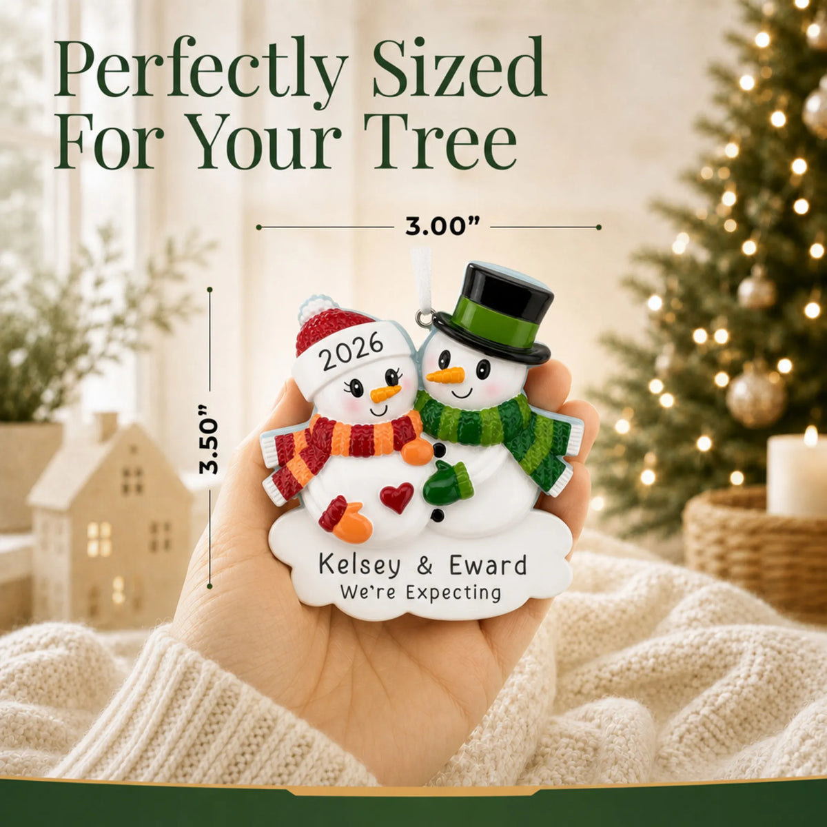 Size guide: the personalized Expecting Snowman Couple christmas ornament is 3.00 in wide by 3.50 in tall, shown in hand