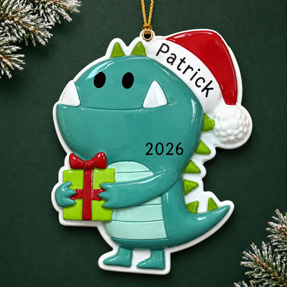Personalized christmas monster ornament on a dark green pine background