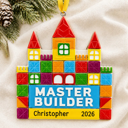 Personalized master tile builder christmas ornament laid on a soft white knit blanket