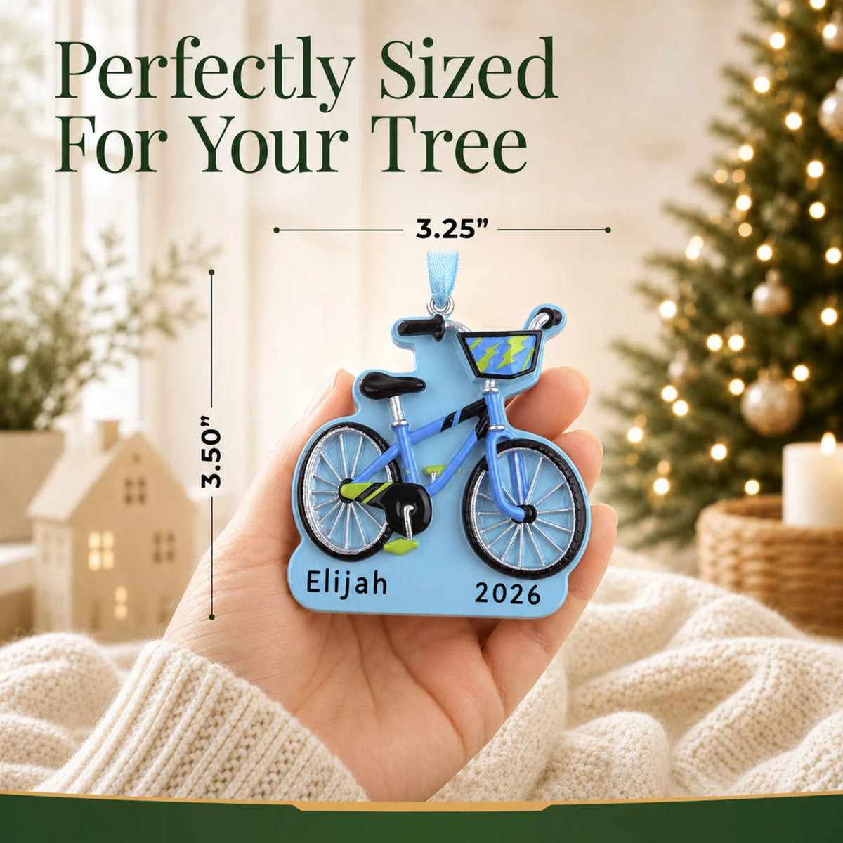 Size guide: the personalized boy's first bike christmas ornament is 3.25 in wide by 3.50 in tall, shown in hand