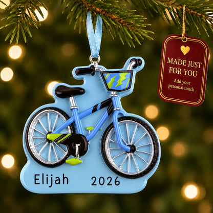 Boy's first bike christmas ornament hanging on a lit Christmas tree with a Made Just For You gift tag