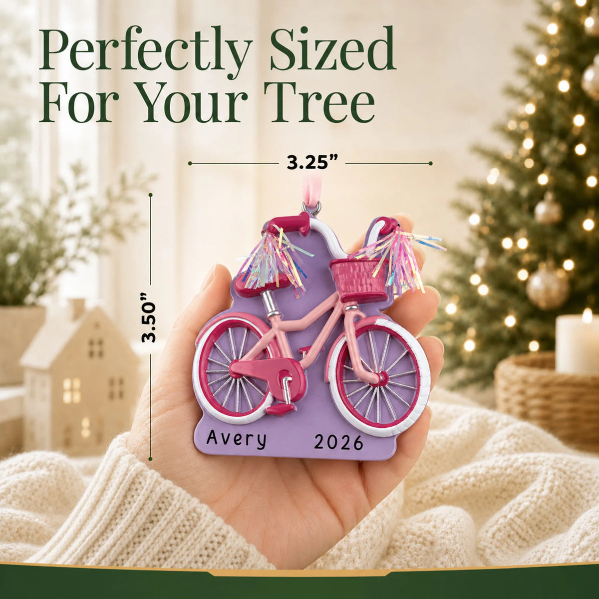 Size guide: the personalized girl's first bike christmas ornament is 3.25 in wide by 3.50 in tall, shown in hand