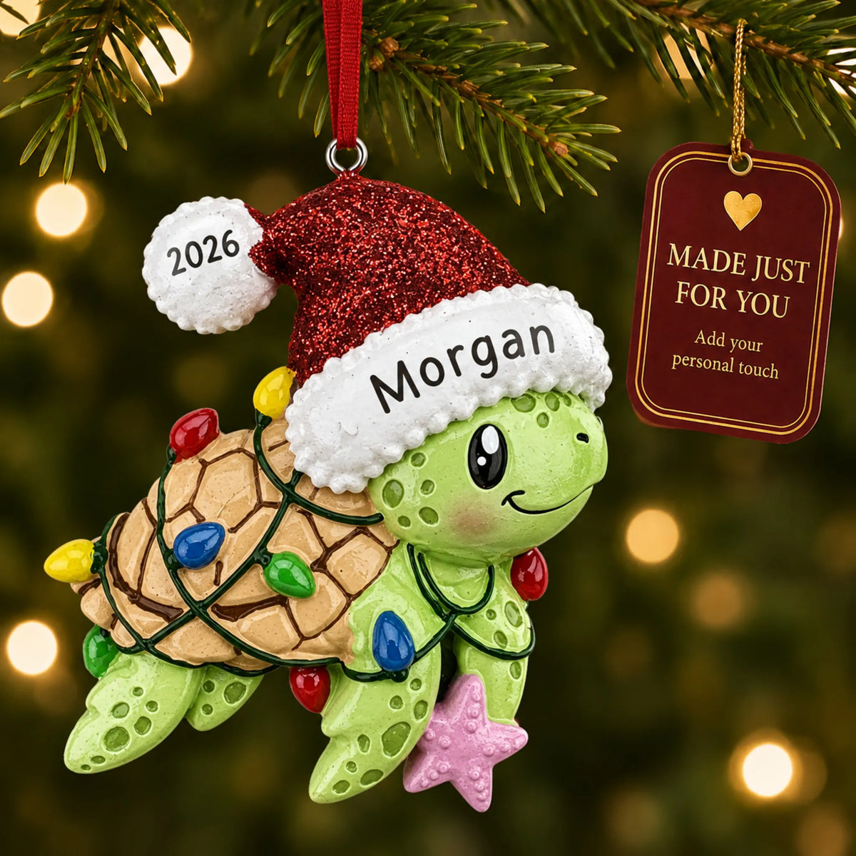 Festive sea turtle christmas ornament hanging on a lit Christmas tree with a Made Just For You gift tag