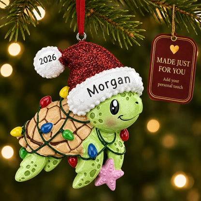 Festive sea turtle christmas ornament hanging on a lit Christmas tree with a Made Just For You gift tag