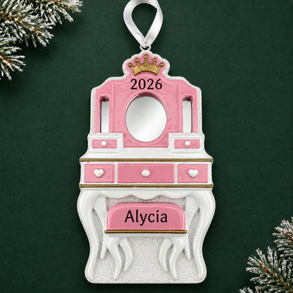 Personalized girls vanity mirror christmas ornament on a dark green pine background