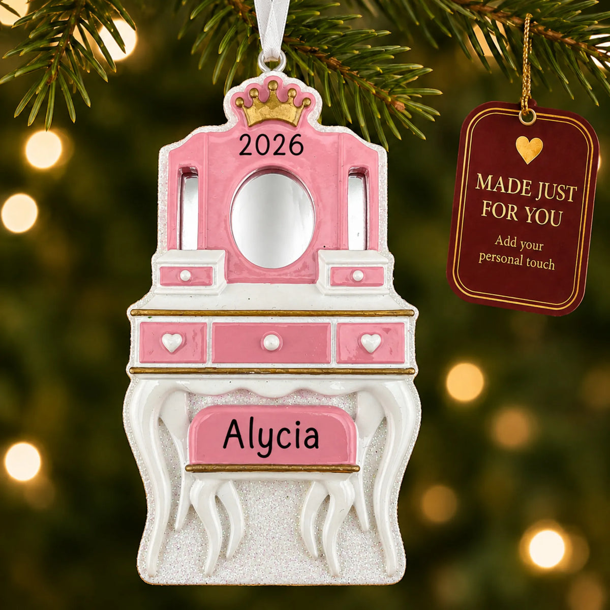 Girls vanity mirror christmas ornament hanging on a lit Christmas tree with a Made Just For You gift tag