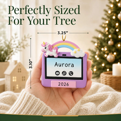 Size guide: the personalized girls tablet christmas ornament is 3.25 in wide by 3.10 in tall, shown in hand
