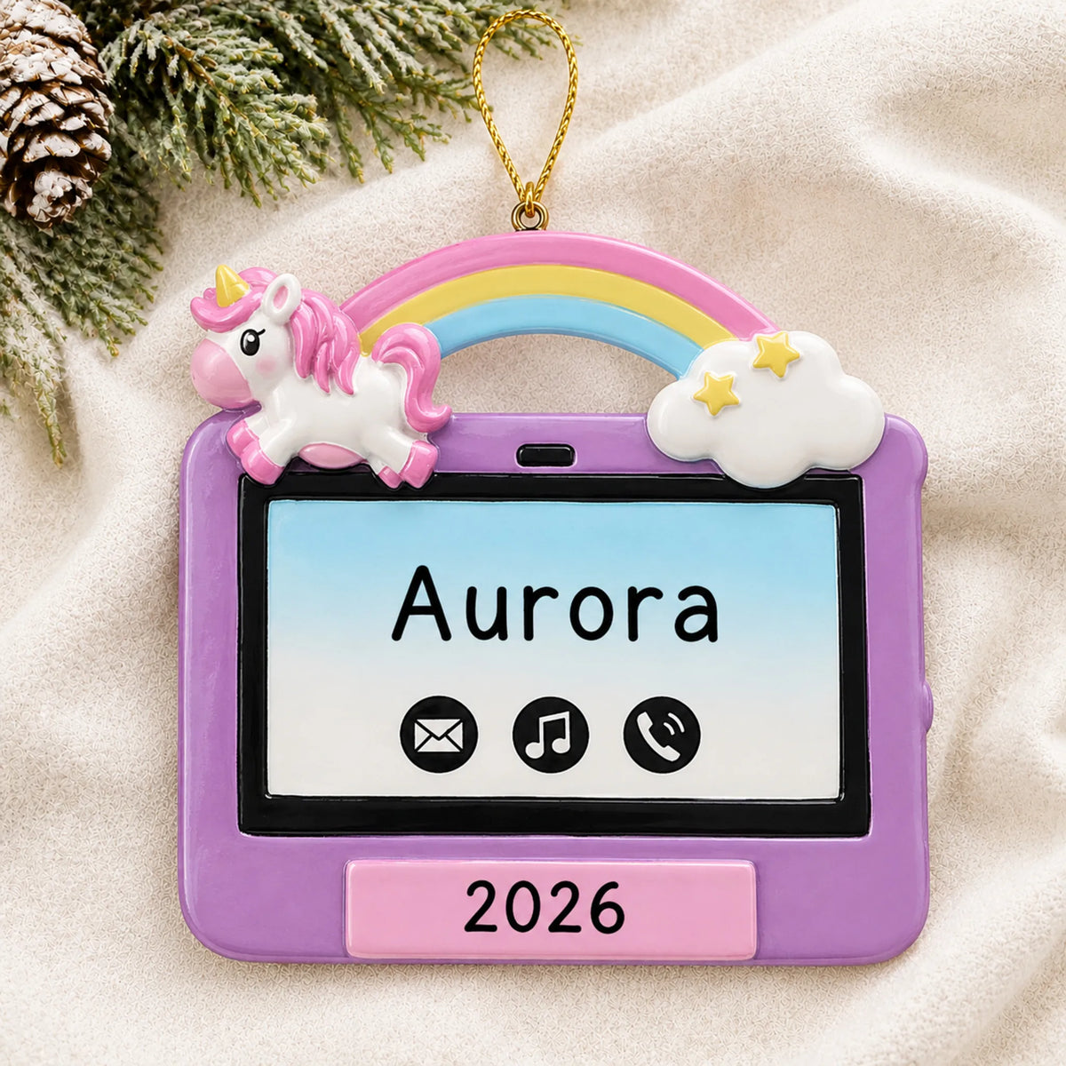 Personalized girls tablet christmas ornament laid on a soft white knit blanket