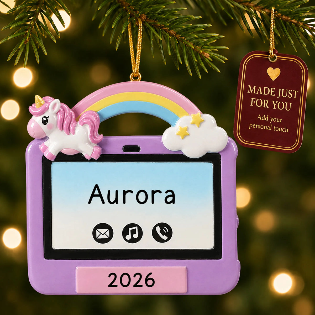 Girls tablet christmas ornament hanging on a lit Christmas tree with a Made Just For You gift tag