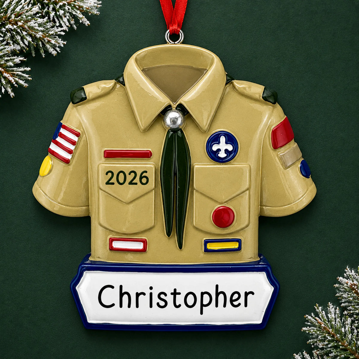 Personalized boy scout christmas ornament on a dark green pine background