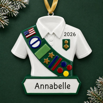Personalized girl scout christmas ornament on a dark green pine background