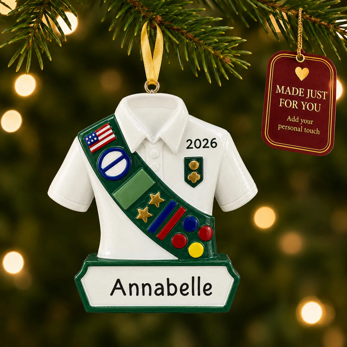 Girl scout christmas ornament hanging on a lit Christmas tree with a Made Just For You gift tag