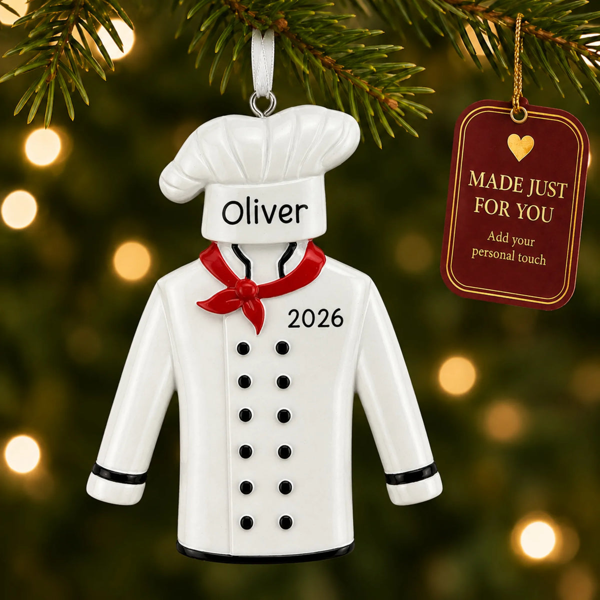 Chef uniform christmas ornament hanging on a lit Christmas tree with a Made Just For You gift tag