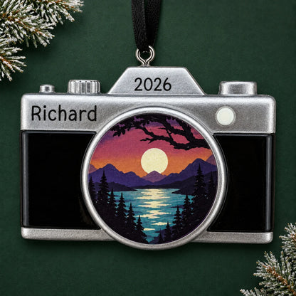 Personalized dslr camera christmas ornament on a dark green pine background