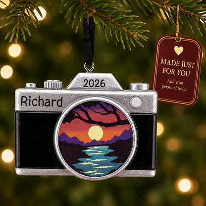 Dslr camera christmas ornament hanging on a lit Christmas tree with a Made Just For You gift tag