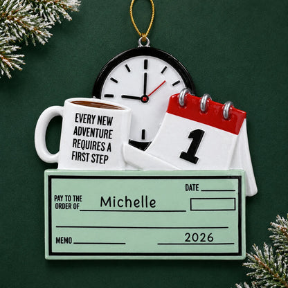 Personalized first job paycheck christmas ornament on a dark green pine background