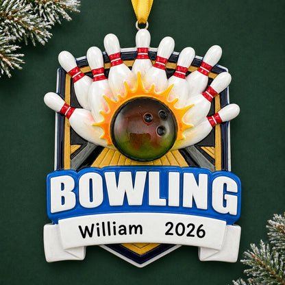 Personalized bowling ball strike christmas ornament on a dark green pine background