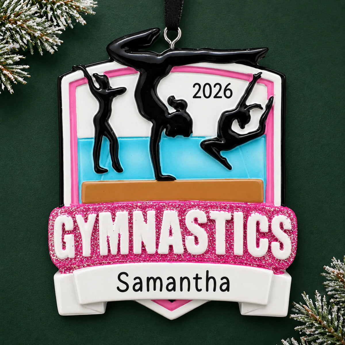 Personalized gymnastics meet christmas ornament on a dark green pine background