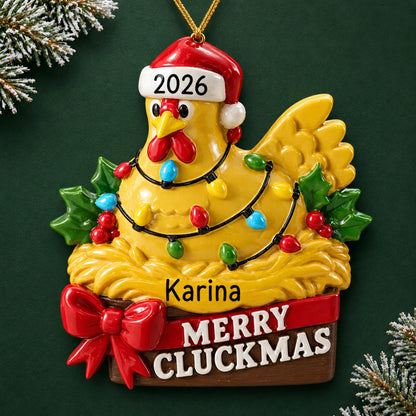 Personalized merry cluckmas chicken christmas ornament on a dark green pine background