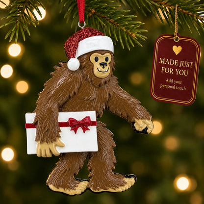 Yeti big foot christmas ornament hanging on a lit Christmas tree with a Made Just For You gift tag