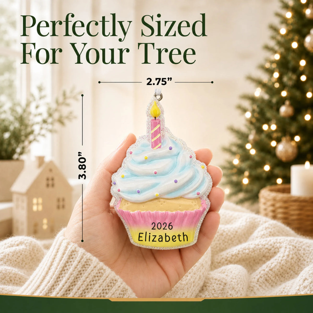 Size guide: the personalized birthday cupcake christmas ornament shown in hand next to a Christmas tree