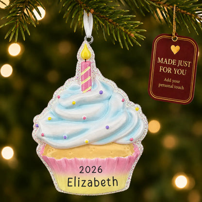 Birthday cupcake christmas ornament hanging on a lit Christmas tree with a Made Just For You gift tag