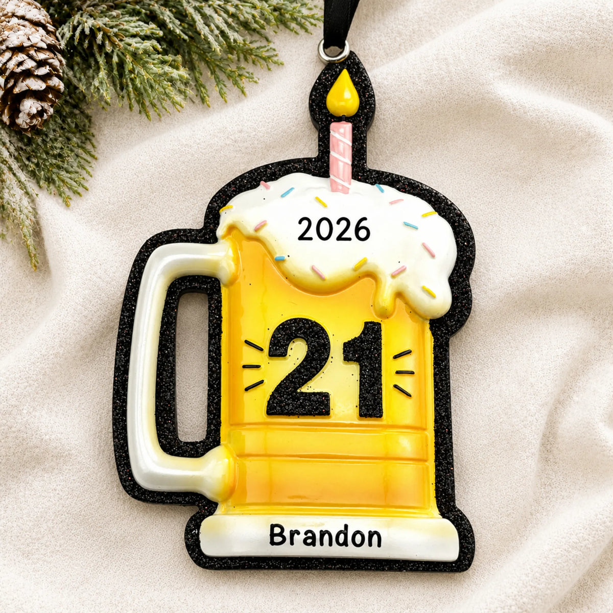 Personalized 21st Birthday Beer Mug christmas ornament laid on a soft white knit blanket