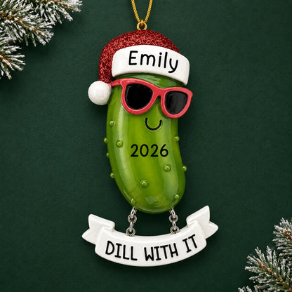 Personalized Pickle christmas ornament on a dark green pine background