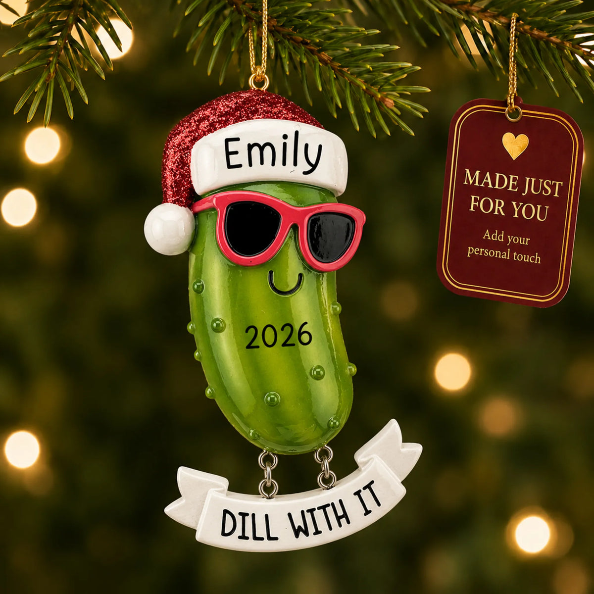 Pickle christmas ornament hanging on a lit Christmas tree with a Made Just For You gift tag