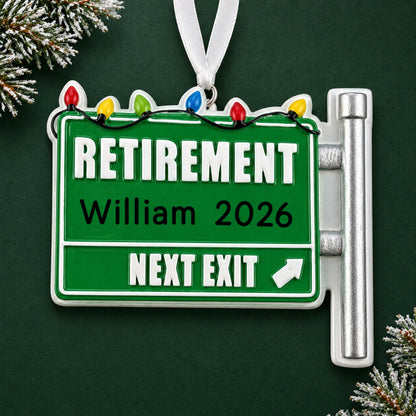 Personalized retirement christmas ornament on a dark green pine background
