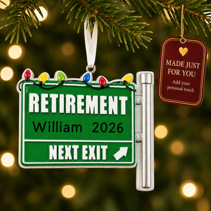 Retirement christmas ornament hanging on a lit Christmas tree with a Made Just For You gift tag