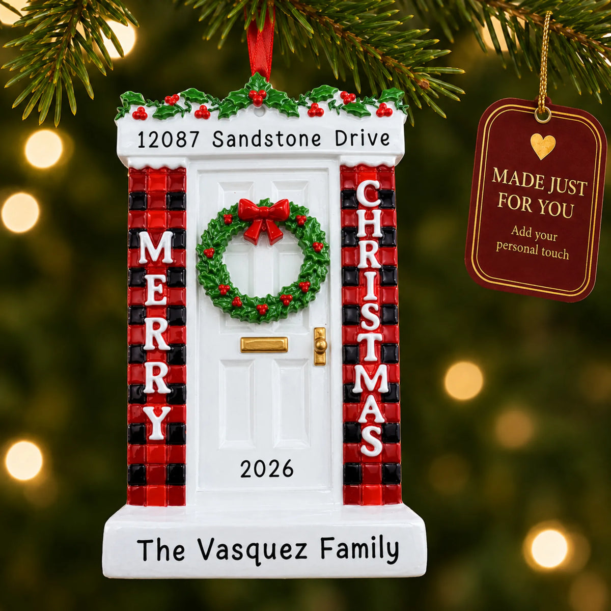 Merry Christmas Door ornament hanging on a lit Christmas tree with a Made Just For You gift tag