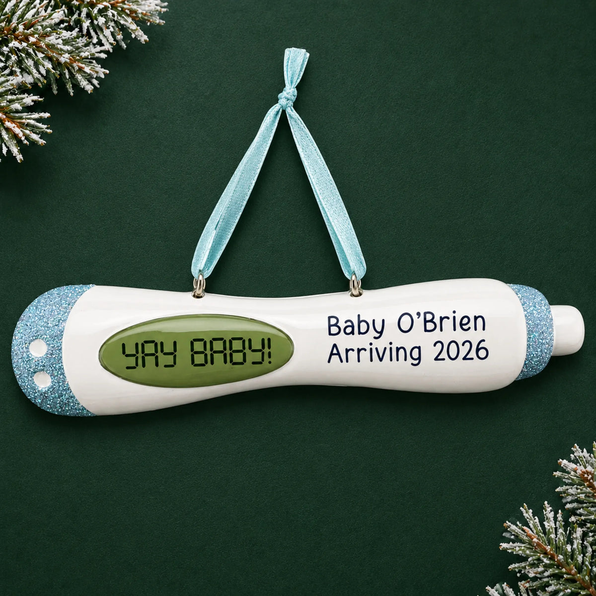 Personalized Pregnancy Test Baby Boy christmas ornament on a dark green pine background