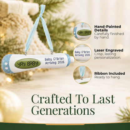 Hand-painted details and laser engraved personalization on the Pregnancy Test Baby Boy christmas ornament, ribbon included