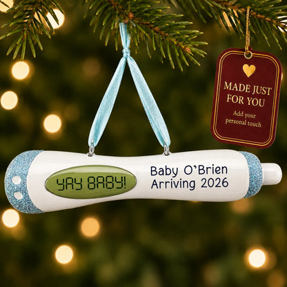 Pregnancy Test Baby Boy christmas ornament hanging on a lit Christmas tree with a Made Just For You gift tag