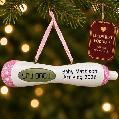 Pregnancy Test Baby Girl christmas ornament hanging on a lit Christmas tree with a Made Just For You gift tag