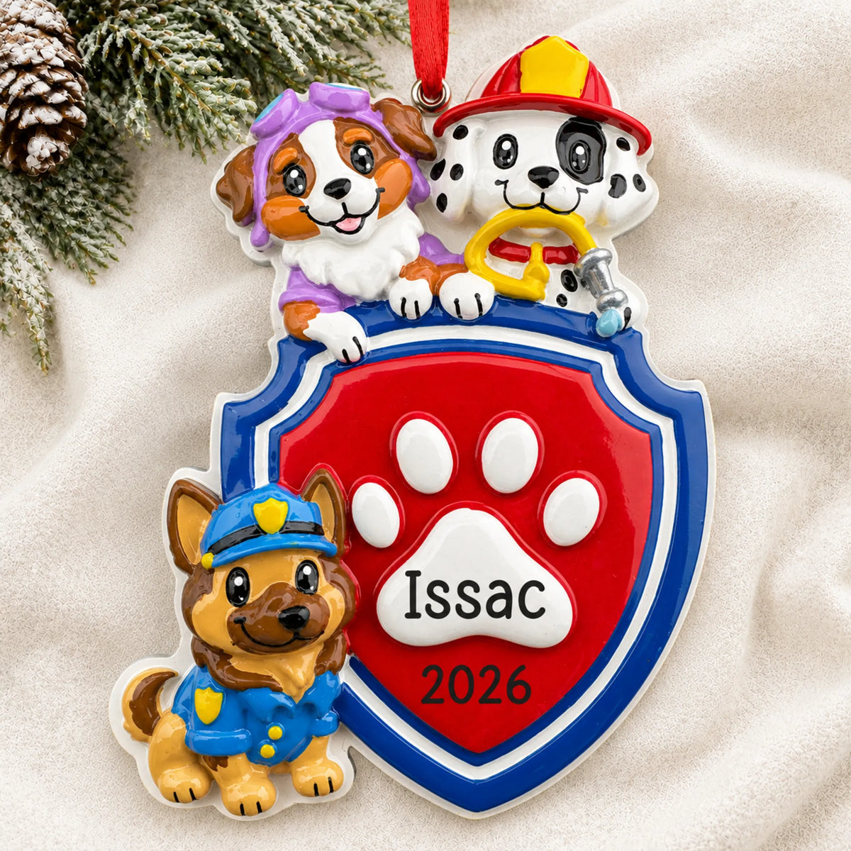 Personalized puppy rescue squad christmas ornament laid on a soft white knit blanket